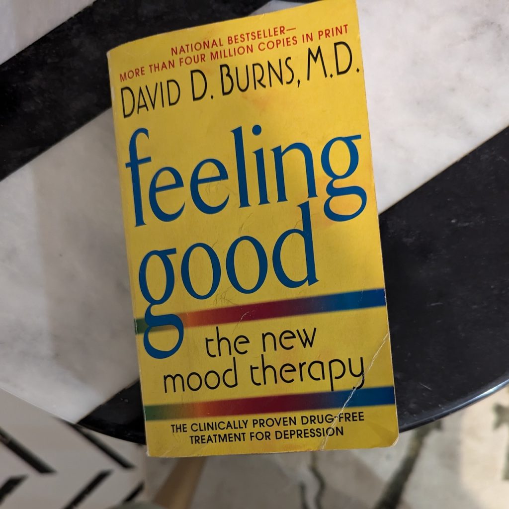 Feeling good by David Burns sitting on a table